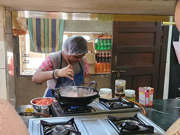 blind bake woman cooking on gas stove