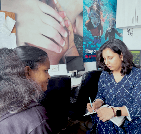NAB Centre counsellor counselling a blind womenwomen