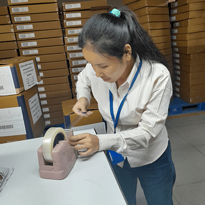 Dilmaya, a blind women trainee of NAB centre is packing products at her workplace